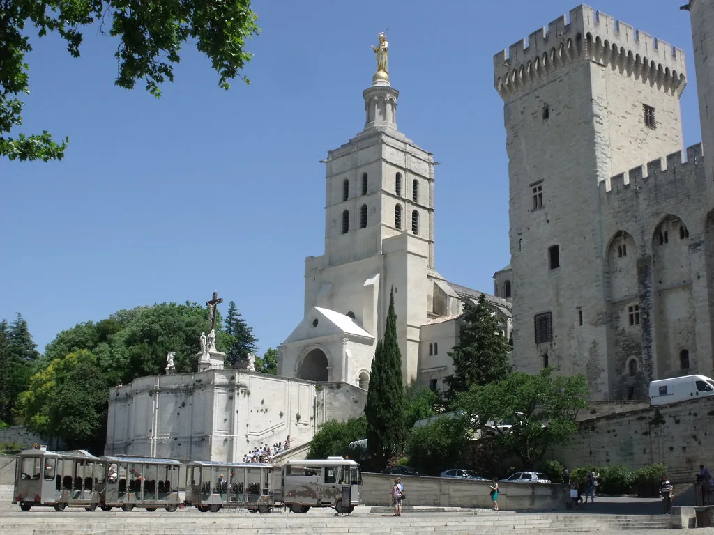 Venue view: Notre-Dame des Doms Cathedral and the Papal Palace on Place du Palais in Avignon. Resized and converted to WebP.
