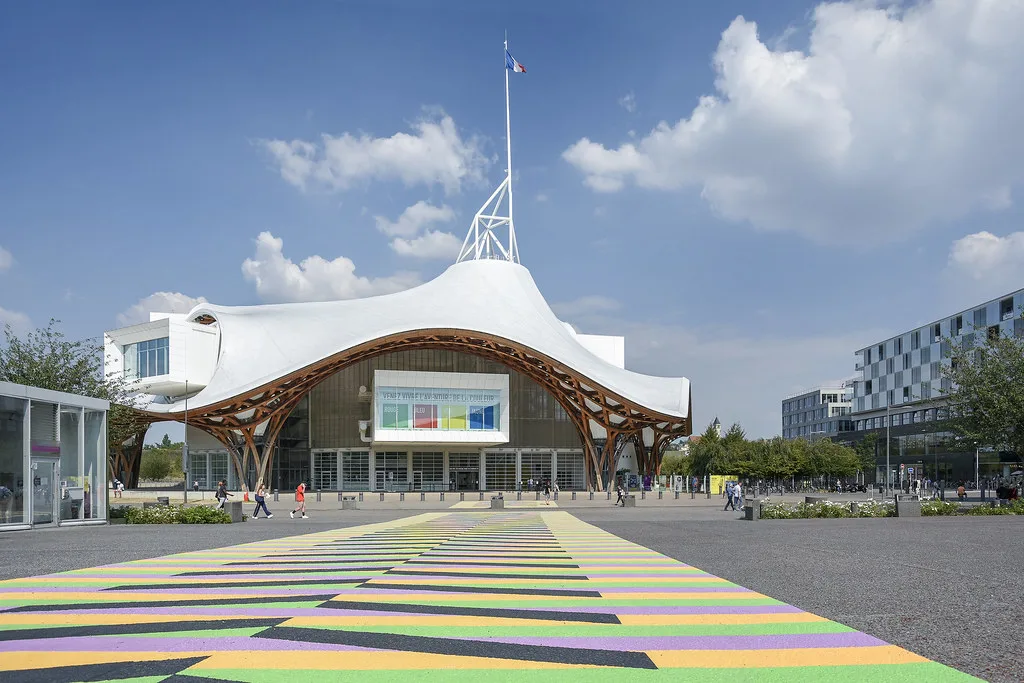 Venue view: the Centre Pompidou-Metz, with its distinctive roof structure and central spire, in Metz, France. Resized and converted to WebP.